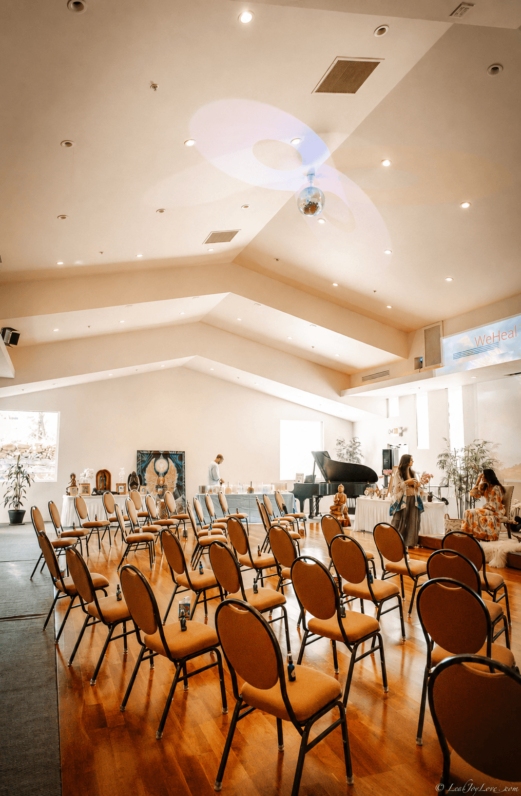 Chairs gather before the grand piano and altar, the Cathedral reset for an evening of music, ceremony and community