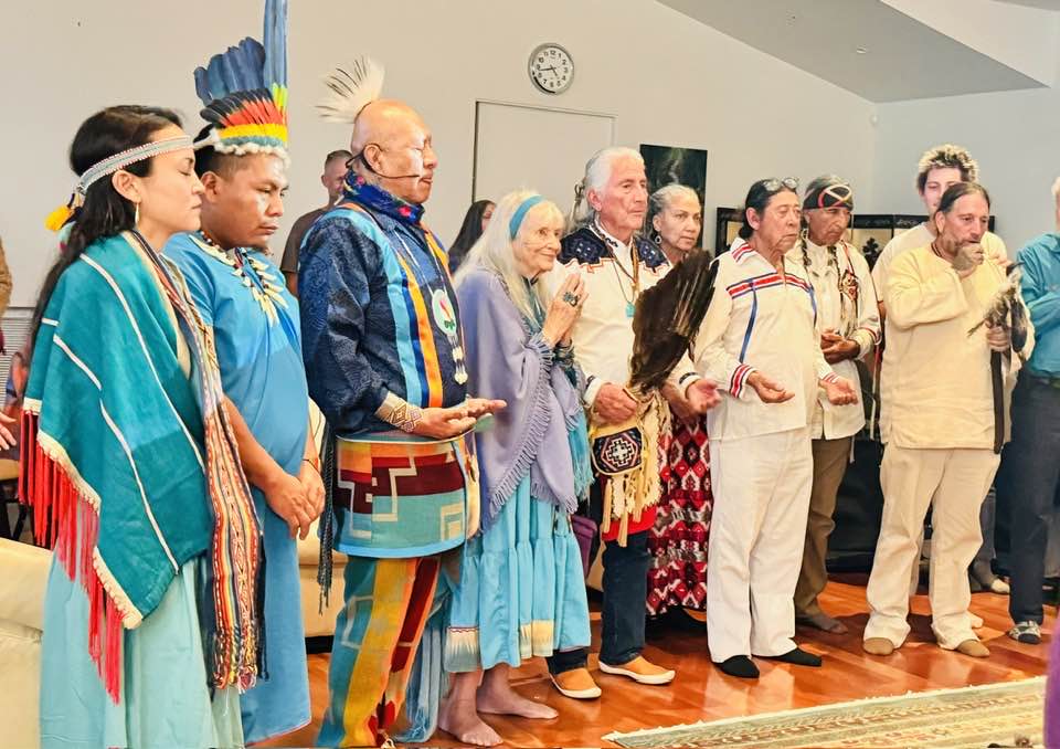 Indigenous elders and wisdom keepers in ceremonial gathering