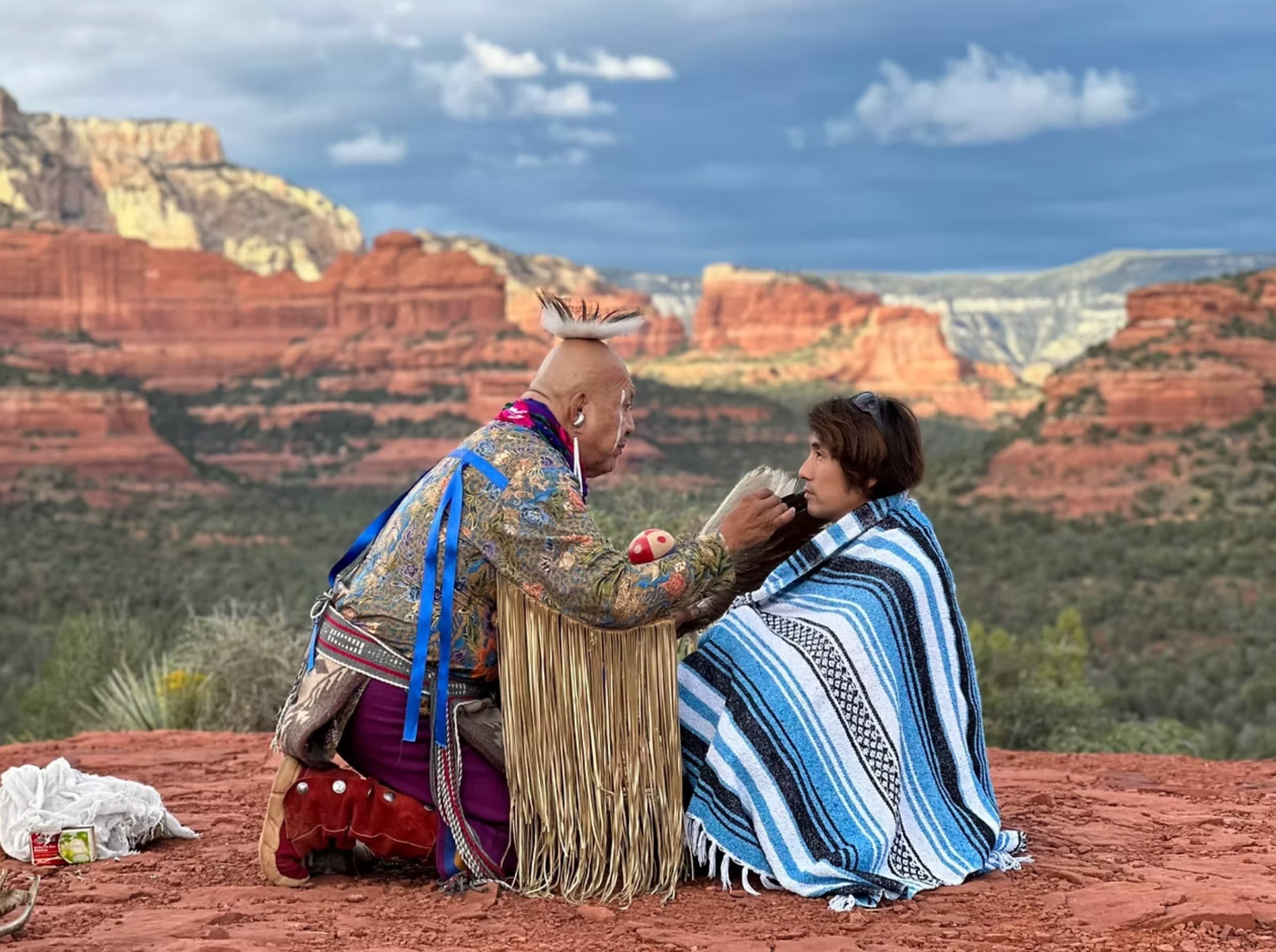 A wisdom keeper offering a blessing on the red rocks of Sedona