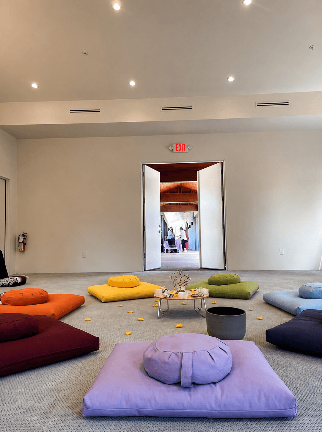 Cushions in every color, open to the garden for community and connection